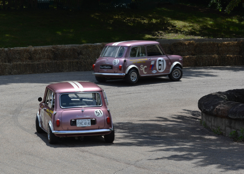 Robert Hoemke in a 1965 Mini Cooper leads Dennis Racine in a 1966 Austin Mini Cooper S